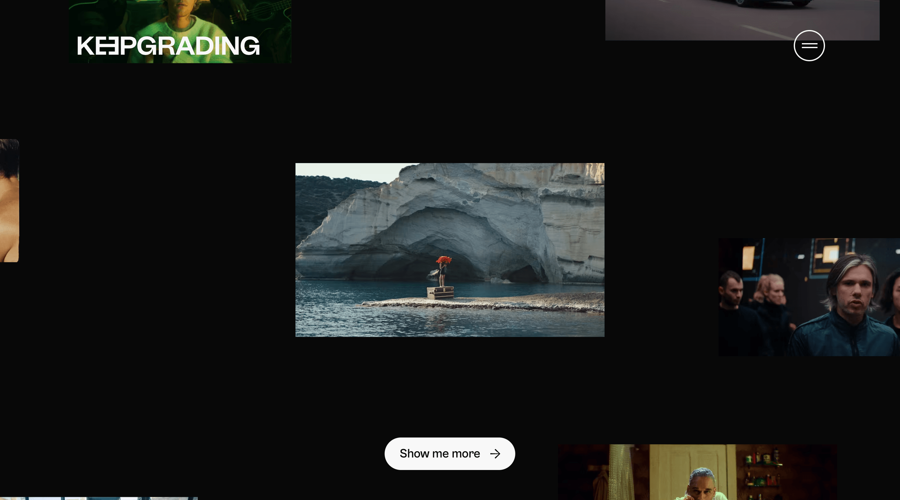 Screenshot of the KeepGrading home page. The KeepGrading logo and menu button appear at the top of the screen. The screen is mostly black, with a series of images scattered around the page. There is a 'Show me more' button at the bottom of the screen.